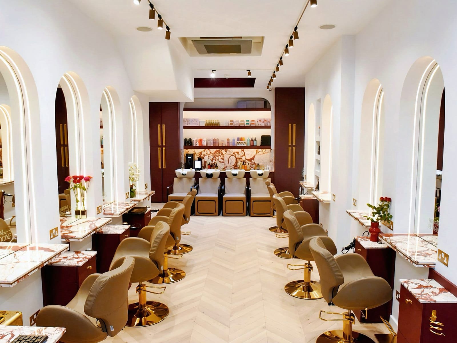 The styling floor at Hakim Elhocine Hair Couture, 11 Blenheim Street, Mayfair, looking down the room in daylight