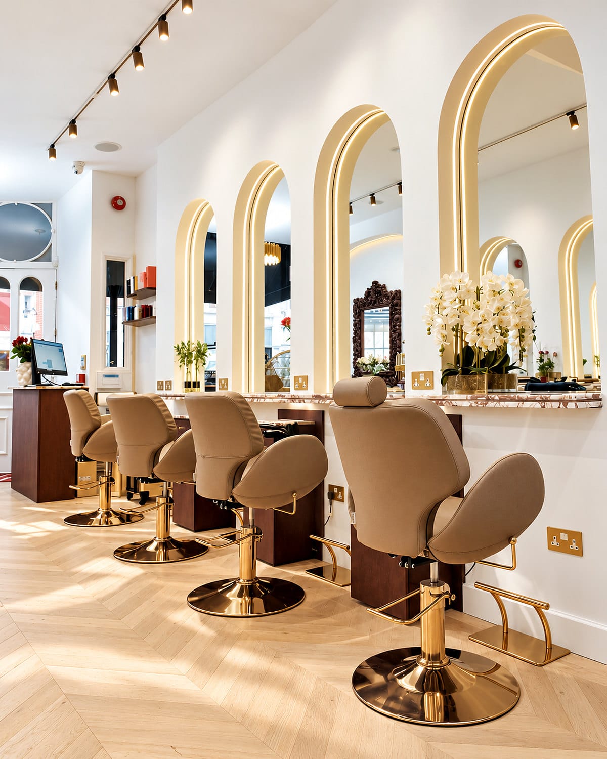 Gold-based styling chairs in daylight at Hakim Elhocine Hair Couture, Mayfair
